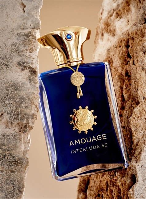 amouage perfume bottle hanging  stone wall amouage interlude