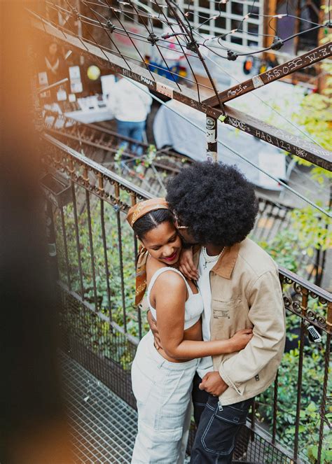 Young Woman Sitting on Mans Lap and Embracing him · Free Stock Photo