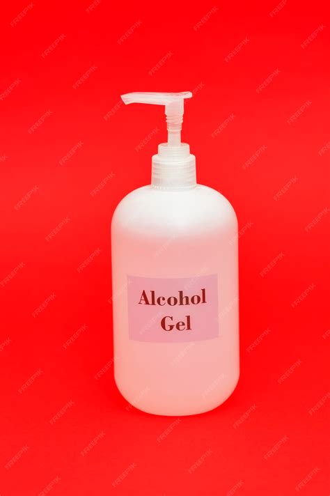 premium photo alcohol gel spray isolated  red background