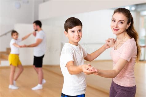 Family Practicing Active Dance in Pairs Stock Photo - Image of ...