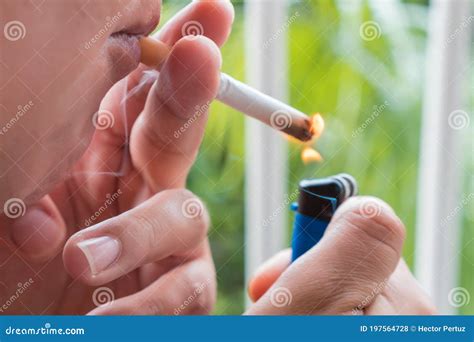 A Woman Addicted To Cigarettes in Her Home Stock Photo - Image of ...