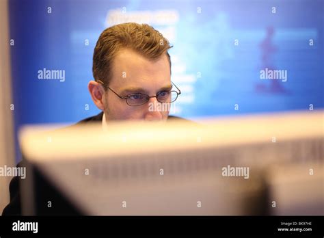 A man working on a computer Stock Photo - Alamy