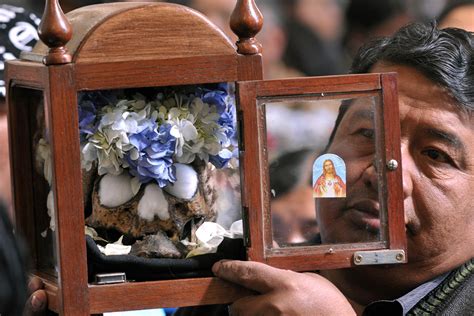 Bolivia: Skulls are Offered Cigarettes, Alcohol and Coca Leaves in ...