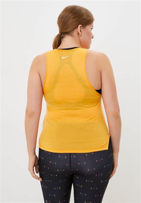 Майка спортивная Nike W NK ICNCLSH TANK BETTER NFS, цвет: желтый ...