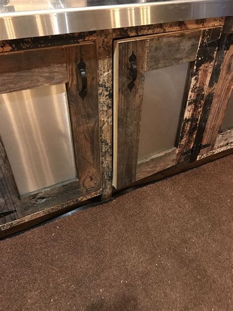 Cabinet doors made with plywood, sheet metal, and 1x4's. painted and ...