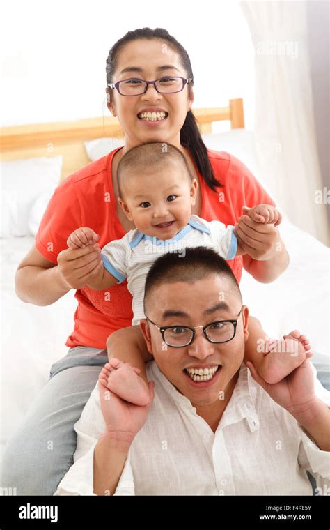 Happy family three Stock Photo - Alamy
