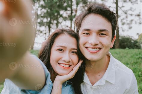Portrait of young Asian couple outside 7218220 Stock Photo at Vecteezy