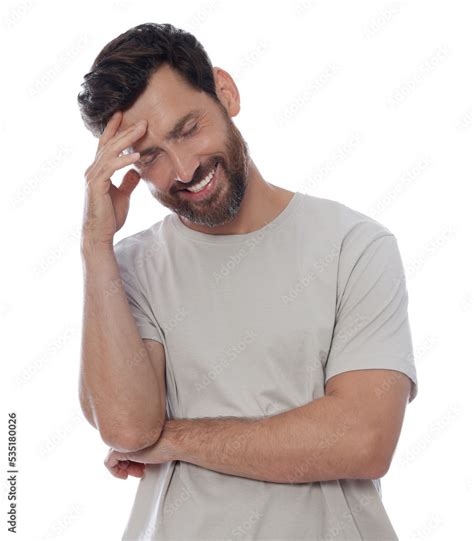 Embarrassed man covering face with hand on white background Stock Photo | Adobe Stock