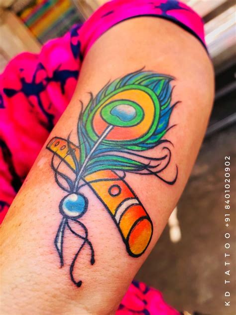 Color feather tattoo | Feather tattoo colour, Tattoos, Star tattoos