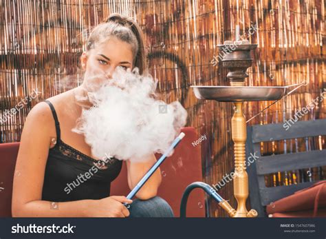 Young Beautiful Woman Smoking Hookah Having Stock Photo 1547607986 ...
