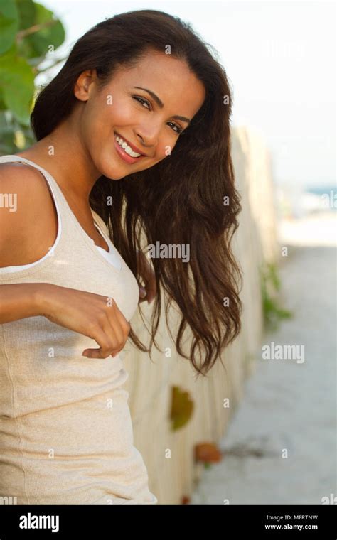 Young beautiful hispanic woman smiling Stock Photo - Alamy