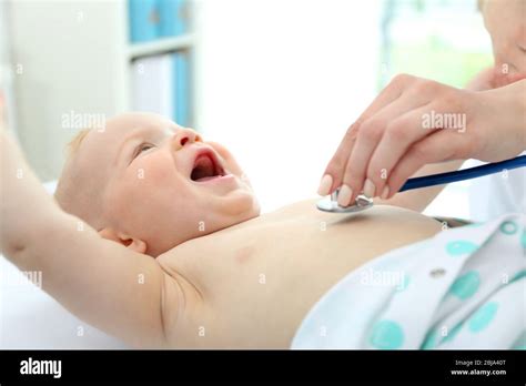 pediatrician examining baby stock photo alamy