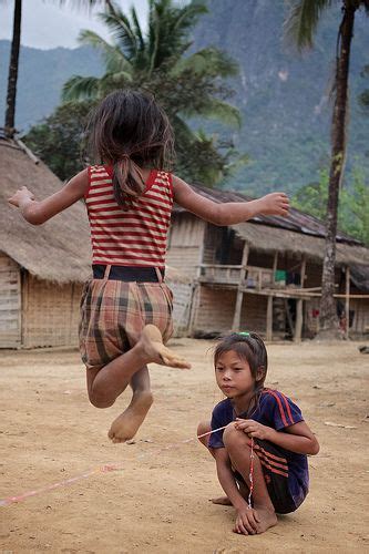 Girls playing games in Khmou Village, Laos | Kids around the world, Laos, People of the world