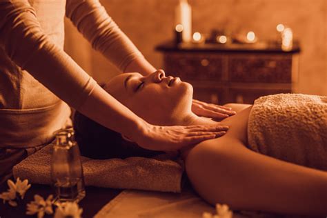 Relaxed Black Woman Having A Massage At The Spa Stock Photo - Download ...
