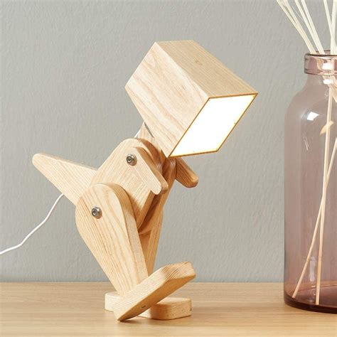 This Posable Wooden Dinosaur Lamp Is Perfect For A Dino Loving Kid's Room