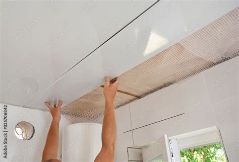PVC Ceiling Panels, Cladding Installation. Builder installing, renovate ...