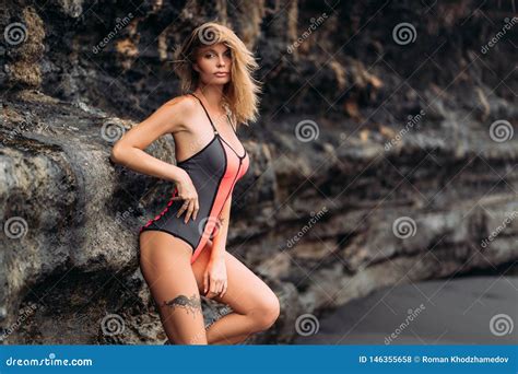 beautiful girl  big breasts   swimsuit sunbathing  black