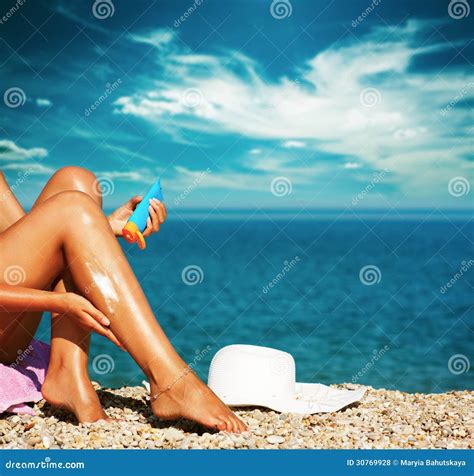 Tan Woman Applying Sunscreen on Legs Stock Photo - Image of protection