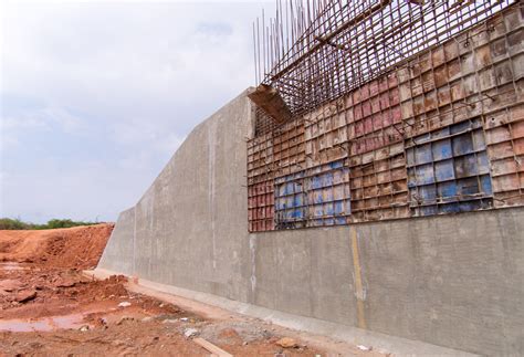 Poured Concrete Retaining Walls Curved Backyard Concrete Patio With