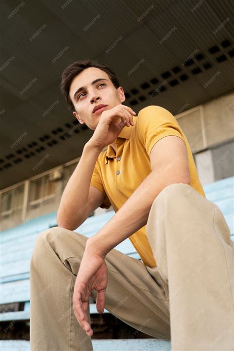 Free Photo | Low angle man posing outdoors