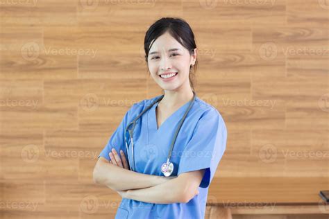 portrait Young beautiful asian successful female doctor or nurse with stethoscope 12684401 Stock ...