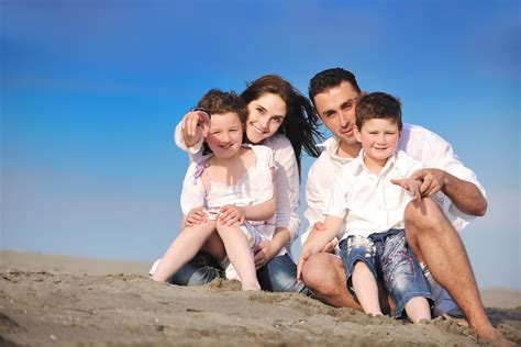 happy young family have fun on beach 12642451 Stock Photo at Vecteezy