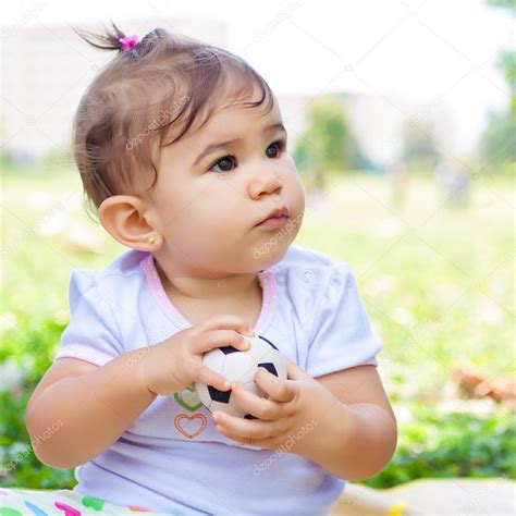 Portrait of a cute hispanic baby girl Stock Photo by ©kmiragaya 23298026