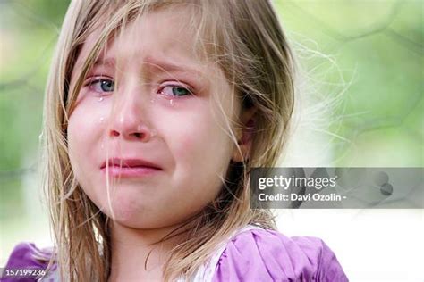 blonde girl crying stock  high res pictures  images