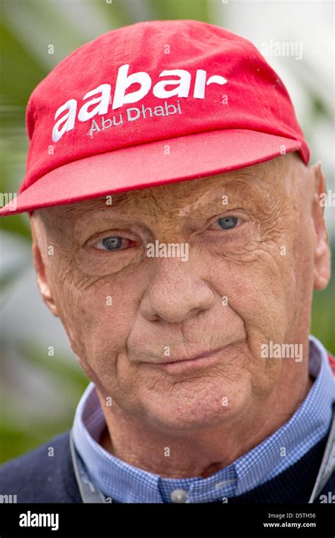 Former Austrian Formula One driver Niki Lauda has a chat in the paddock ...