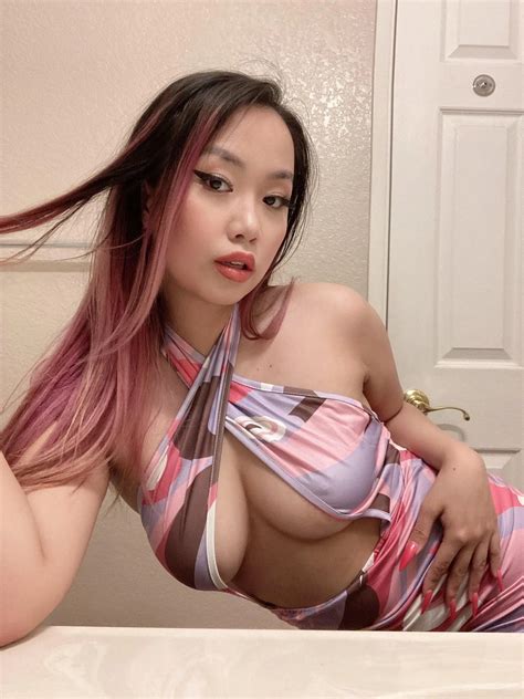 Asian teen loves teasing her huge boobs | Scrolller