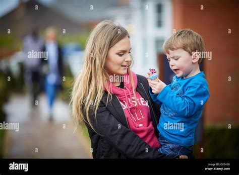 younger brother older sister boy girl viewing houses showroom browsing