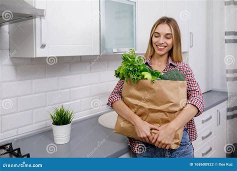 Young Woman is Contented with the Greengrocery Purchases Stock Photo ...