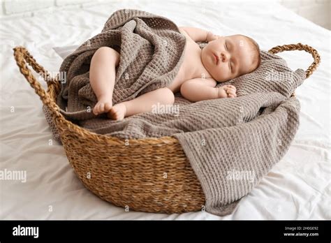 Little baby sleeping in basket Stock Photo - Alamy