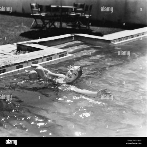 Woman swimming in a pool with a swimming cap Stock Photo: 19116725 - Alamy