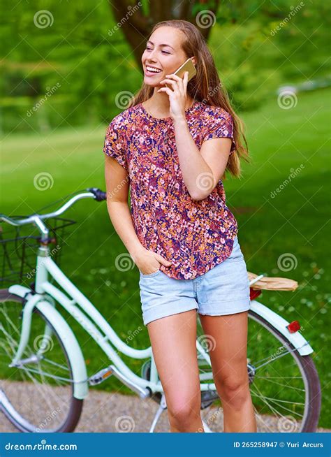 Its Awesome Out Here, You Guys Should Join Me. a Young Woman Using a
