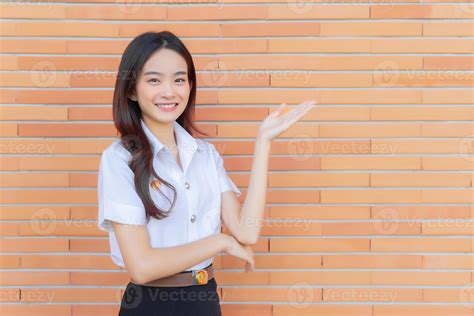 Portrait of an adult Thai student in university student uniform. Asian