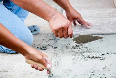 Floor Tile Installation stock image. Image of hands, home - 18557899