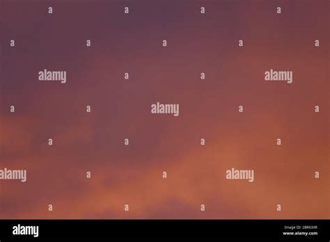 Fire-red lightly clouded sky, sunset, background Stock Photo - Alamy