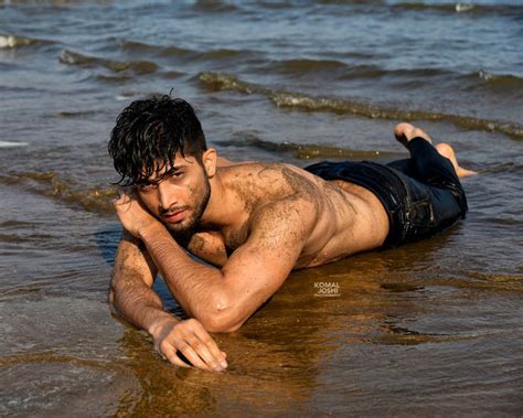 Male Model Beach Shoot | Beach outfit men, Photography poses for men