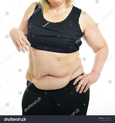 Overweight Middle-aged Woman Shows Belly Fat Stock Photo 1412960435