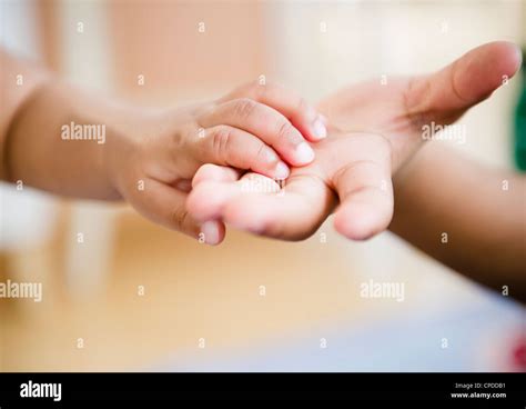 Black brother and sister holding hands Stock Photo - Alamy