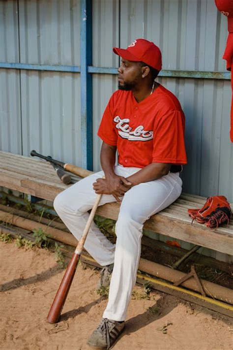 baseball player sitting   bench  stock photo