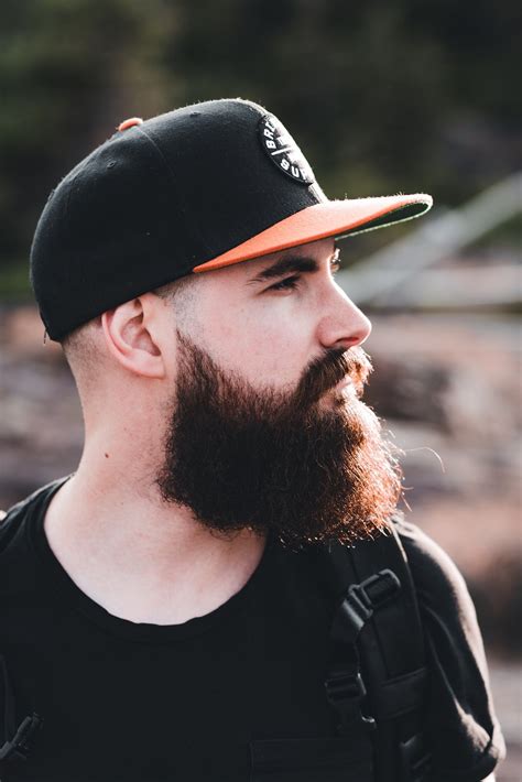 Side View of Full Beard Man Wearing a Cap · Free Stock Photo