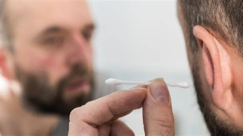man cleans ear  cotton swab suffers seizures   skull