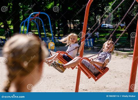 children swinging  playground stock photo image  caucasian love