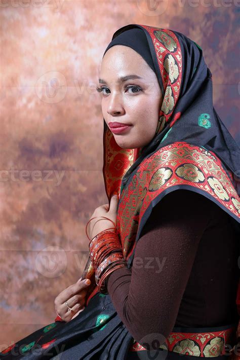 South east Asian Malay race ethnic origin woman wearing Indian dress