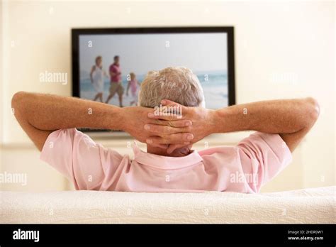senior watching tv elderly  seniors television tv stock photo