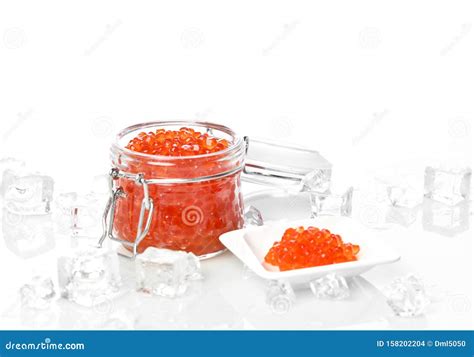 Salmon or Keta Red Caviar in Jar Can and Little Plate with Ice on Table ...