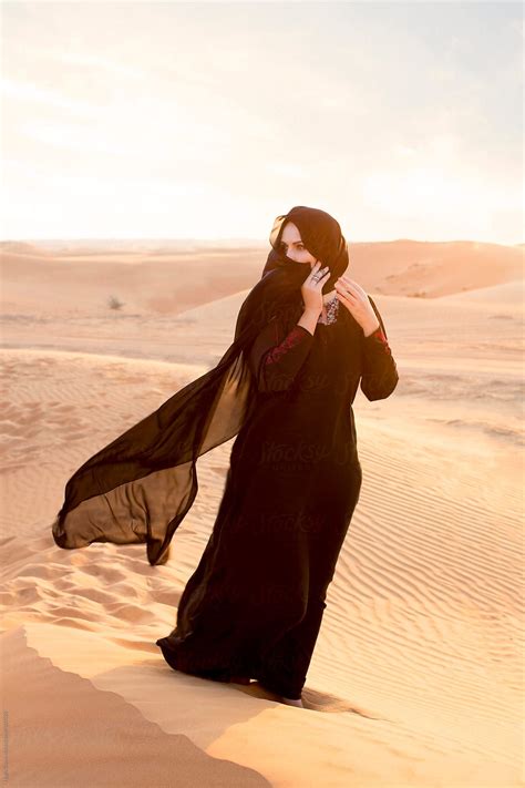 Arabian woman in traditional costume, Dubai desert. U.A.E. by Hugh