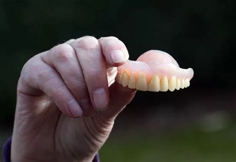 Man reunited with false teeth 11 years after he vomited them into ...